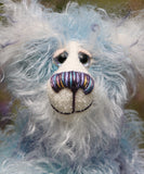 Hyssop is a gentle, happy teddy bear, a beautifully blue one of a kind, hand dyed mohair artist bear by Barbara-Ann Bears, he stands 9 inches/23 cm tall  Hyssop is mainly made from a fairly long, sparse hand dyed sky blue, coupled with a long fluffy white mohair with blue tipping and hand-dyed velvet paw pads.   Hyssop has beautiful hand painted eyes with eyelids, a nose embroidered from individual threads to complement his colouring and he has a huge, friendly smile.