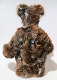 Jefferson Spruce is a very shaggy, wild and wonderful, one of a kind, artist teddy bear in beautiful Tissavel faux fur & fluffy mohair by Barbara-Ann Bears, he stands 19.5 inches/50 cm tall. Jefferson Spruce is made from brown faux fur and very long and fluffy beige mohair, with beige wool felt paws, hand painted eyes and eyelids, a wonderful nose and sweet soulful smile