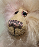 Jerry has beautifully hand painted glass eyes with eyelids and a wonderfully embroidered nose, sewn from individual threads to match his colouring. He has a thoughtful expression and a huge beaming smile