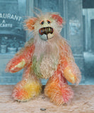 Keith is a very happy and colourful little one of a kind, hand dyed mohair artist bear by Barbara-Ann Bears, he stands 6 inches/15 cm tall.
Keith is made from hand dyed mohair, with hand dyed velvet paws, hand painted eyes and eyelids and a striking nose and sweet smile