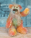 Keith is a very happy and colourful little one of a kind, hand dyed mohair artist bear by Barbara-Ann Bears, he stands 6 inches/15 cm tall.
Keith is made from hand dyed mohair, with hand dyed velvet paws, hand painted eyes and eyelids and a striking nose and sweet smile