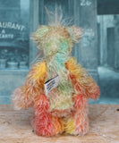 Keith is a very happy and colourful little one of a kind, hand dyed mohair artist bear by Barbara-Ann Bears, he stands 6 inches/15 cm tall.
Keith is made from hand dyed mohair, with hand dyed velvet paws, hand painted eyes and eyelids and a striking nose and sweet smile