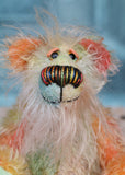 Keith is a very happy and colourful little one of a kind, hand dyed mohair artist bear by Barbara-Ann Bears, he stands 6 inches/15 cm tall.
Keith is made from hand dyed mohair, with hand dyed velvet paws, hand painted eyes and eyelids and a striking nose and sweet smile