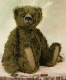 Kingsley Greenacre is a very sweet and cuddly one of a kind traditional artist teddy bear by Barbara Ann Bears in bottle green mohair he is 13 inches/33cm tall.  Kingsley Greenacre is made from a beautiful, distressed bottle green German mohair and he has German wool-felt paw pads that coordinate very well with his mohair. Kingsley has boot buttons for eyes, just like the really old teddy bears. He has a carefully embroidered nose and a sweet smile.