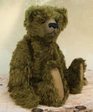 Kingsley Greenacre is a very sweet and cuddly one of a kind traditional artist teddy bear by Barbara Ann Bears in bottle green mohair he is 13 inches/33cm tall.  Kingsley Greenacre is made from a beautiful, distressed bottle green German mohair and he has German wool-felt paw pads that coordinate very well with his mohair. Kingsley has boot buttons for eyes, just like the really old teddy bears. He has a carefully embroidered nose and a sweet smile.