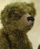 Kingsley Greenacre is a very sweet and cuddly one of a kind traditional artist teddy bear by Barbara Ann Bears in bottle green mohair he is 13 inches/33cm tall.  Kingsley Greenacre is made from a beautiful, distressed bottle green German mohair and he has German wool-felt paw pads that coordinate very well with his mohair. Kingsley has boot buttons for eyes, just like the really old teddy bears. He has a carefully embroidered nose and a sweet smile.