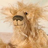Close-up of a plush teddy bear with a soft focus background