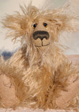Lachlan is a wild and groovy guy, a one of a kind artist bear from Barbara-Ann Bears in long beige scraggly mohair, he stands 8 inches/20 cm tall