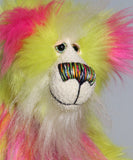 Leonardo is a flamboyant, fun-loving and comical, one of a kind, artist bear by Barbara-Ann Bears in luxurious mohair and rather wild lime faux fur, he stands 12 inches/30 cm tall Leonardo is made from lime faux fur, with a very long faux fur in pink, greyish blue and gold, a bright cerise faux fur and long and fluffy white mohair.His paws are cerise wool felt.  Leonardo has beautiful hand painted glass eyes with eyelids, a wonderfully embroidered nose and he has a huge beaming smile.