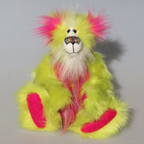 Leonardo is a flamboyant, fun-loving and comical, one of a kind, artist bear by Barbara-Ann Bears in luxurious mohair and rather wild lime faux fur, he stands 12 inches/30 cm tall Leonardo is made from lime faux fur, with a very long faux fur in pink, greyish blue and gold, a bright cerise faux fur and long and fluffy white mohair.His paws are cerise wool felt.  Leonardo has beautiful hand painted glass eyes with eyelids, a wonderfully embroidered nose and he has a huge beaming smile.