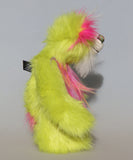 Leonardo is a flamboyant, fun-loving and comical, one of a kind, artist bear by Barbara-Ann Bears in luxurious mohair and rather wild lime faux fur, he stands 12 inches/30 cm tall Leonardo is made from lime faux fur, with a very long faux fur in pink, greyish blue and gold, a bright cerise faux fur and long and fluffy white mohair.His paws are cerise wool felt.  Leonardo has beautiful hand painted glass eyes with eyelids, a wonderfully embroidered nose and he has a huge beaming smile.