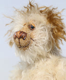 Lumbley is an endearingly sweet and gentle, beautifully coloured, one of a kind,  artist bear by Barbara-Ann Bears, Lumbley stands 10 inches/ 25 cm tall. e's made from cream coloured mohair which has a pale tan backcloth and he has a little mohawk on his head and fluffy ears.