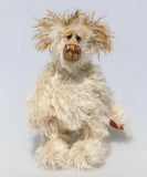 Lumbley is an endearingly sweet and gentle, beautifully coloured, one of a kind,  artist bear by Barbara-Ann Bears, Lumbley stands 10 inches/ 25 cm tall. e's made from cream coloured mohair which has a pale tan backcloth and he has a little mohawk on his head and fluffy ears.