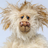 Lumbley is an endearingly sweet and gentle, beautifully coloured, one of a kind,  artist bear by Barbara-Ann Bears, Lumbley stands 10 inches/ 25 cm tall. e's made from cream coloured mohair which has a pale tan backcloth and he has a little mohawk on his head and fluffy ears.