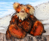 Marigold sitting.
Marigold is a very large and beautifully coloured, one of a kind, artist bear by Barbara Ann Bears in luxurious fluffy black tipped orange faux fur and very long gold coloured mohair, she stands 24 inches/60 cm tall
