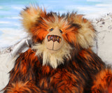 Marigold's face and shoulders. Showing her beautiful hand painted eyes, wonderful nose and sweet smile.
Marigold is a very large and beautifully coloured, one of a kind, artist bear by Barbara Ann Bears in luxurious fluffy black tipped orange faux fur and very long gold coloured mohair, she stands 24 inches/60 cm tall