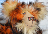 Marigold's face, close up. Showing her beautiful hand painted eyes, wonderful nose and sweet smile.
Marigold is a very large and beautifully coloured, one of a kind, artist bear by Barbara Ann Bears in luxurious fluffy black tipped orange faux fur and very long gold coloured mohair, she stands 24 inches/60 cm tall