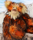 Marigold sitting, close up.
Marigold is a very large and beautifully coloured, one of a kind, artist bear by Barbara Ann Bears in luxurious fluffy black tipped orange faux fur and very long gold coloured mohair, she stands 24 inches/60 cm tall