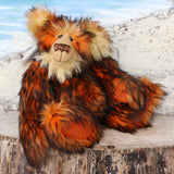 Marigold sitting.
Marigold is a very large and beautifully coloured, one of a kind, artist bear by Barbara Ann Bears in luxurious fluffy black tipped orange faux fur and very long gold coloured mohair, she stands 24 inches/60 cm tall