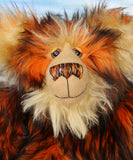 Marigold's face, close up. Showing her beautiful hand painted eyes, wonderful nose and sweet smile.
Marigold is a very large and beautifully coloured, one of a kind, artist bear by Barbara Ann Bears in luxurious fluffy black tipped orange faux fur and very long gold coloured mohair, she stands 24 inches/60 cm tall