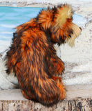 Marigold standing, shown in profile.
Marigold is a very large and beautifully coloured, one of a kind, artist bear by Barbara Ann Bears in luxurious fluffy black tipped orange faux fur and very long gold coloured mohair, she stands 24 inches/60 cm tall