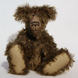 Murdo is a wild and handsome, one of a kind, artist bear by Barbara-Ann Bears in wonderful long and straggly mohair, he stands 18 inches/ 46cm tall.  Murdo is made from a long and wildly tousled, medium brown mohair, with hand painted glass eyes with eyelids, a wonderfully embroidered nose and an engaging smile.