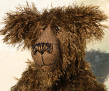 Murdo has beautiful hand painted slightly sparkling glass eyes (they were painted to match his mohair) with eyelids, an impressive and wonderfully embroidered nose, sewn from individual threads to match his mohair and an engaging smile.