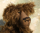 Murdo has beautiful hand painted slightly sparkling glass eyes (they were painted to match his mohair) with eyelids, an impressive and wonderfully embroidered nose, sewn from individual threads to match his mohair and an engaging smile.