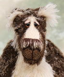 Nicholas Prickleless has beautiful hand painted slightly sparkling glass eyes (they were painted to complement his mohair) with eyelids, a wonderful nose embroidered with individual threads to match his mohair and a broad and cheerful smile