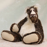 Nicholas Prickleless is a downbeat and curious one of a kind, mohair artist bear by Barbara-Ann Bears, he stands 9 inches/ 23 cm tall Nicholas Prickleless is mostly made from a dense, short dark brown mohair with white tipping, couple with a longer pale cream mohair, cream ultrasuede paws, hand painted eyes and a sweet smile