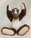 Nicholas Prickleless is a downbeat and curious one of a kind, mohair artist bear by Barbara-Ann Bears, he stands 9 inches/ 23 cm tall Nicholas Prickleless is mostly made from a dense, short dark brown mohair with white tipping, couple with a longer pale cream mohair, cream ultrasuede paws, hand painted eyes and a sweet smile