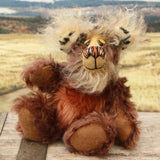 Nimble Nigel sitting and waving. Nimble Nigel is an endearingly sweet and joyful one of a kind artist bear by Barbara-Ann Bears in wonderful brown mohair, he stands just 6.5 inches/17cm