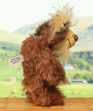 Nimble Nigel standing, side profile. Nimble Nigel is an endearingly sweet and joyful one of a kind artist bear by Barbara-Ann Bears in wonderful brown mohair, he stands just 6.5 inches/17cm