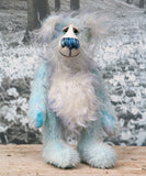 Perry is a gentle, happy teddy bear, a beautifully blue one of a kind, hand dyed mohair artist bear by Barbara-Ann Bears, he stands 9 inches/23 cm tall.   Perry is mainly made from a fairly short, sparse hand dyed sky blue, couple with a long fluffy white mohair with blue tipping and hand-dyed velvet paw pads.