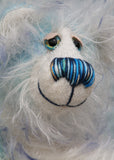 Perry has beautiful hand painted eyes with eyelids, a nose embroidered from individual threads to complement his colouring and he has a huge, friendly smile. Perry is mainly made from a fairly short, sparse hand dyed sky blue, couple with a long fluffy white mohair with blue tipping and hand-dyed velvet paw pads.