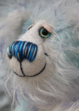 Perry has beautiful hand painted eyes with eyelids, a nose embroidered from individual threads to complement his colouring and he has a huge, friendly smile. Perry is mainly made from a fairly short, sparse hand dyed sky blue, couple with a long fluffy white mohair with blue tipping and hand-dyed velvet paw pads.
