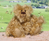 Robbie McFluff is a cute and quite little one of a kind artist bear in wildly curly mohair by Barbara-Ann Bears, he stands just 7 inches(18 cm) tall and is 5.5 inches (14 cm) sitting. Robbie is made from wonderful, wildly curly beige gold mohair, with a slightly warmer backcloth and he has beige German wool felt paw pads