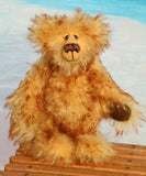 Rutherford is a sweet and very friendly, one of a kind, artist teddy bear in beautiful tipped mohair by Barbara-Ann Bears
Rutherford stands 9 inches/23 cm tall. 
Rutherford is made from long, dense, brown tipped gold mohair with brown German wool felt paw pads. He has beautiful hand painted, twinkling, glass eyes with hand coloured eyelids, a splendid nose embroidered from individual threads and a happy, hopeful expression