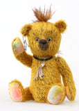 Scuggs is an endearingly sweet and gently wild beautifully coloured one of a kind, mohair artist bear by Barbara-Ann Bears, he stands 13 inches/33 cm tall and is 10.5 inches/26 cm sitting. He is made from gold mohair which has a dark brown backcloth, with a mohawk, hand dyed paw pads, and hand painted eyes with eyelids