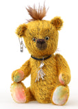 Scuggs is an endearingly sweet and gently wild beautifully coloured one of a kind, mohair artist bear by Barbara-Ann Bears, he stands 13 inches/33 cm tall and is 10.5 inches/26 cm sitting. He is made from gold mohair which has a dark brown backcloth, with a mohawk, hand dyed paw pads, and hand painted eyes with eyelids