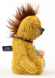 Scuggs is an endearingly sweet and gently wild beautifully coloured one of a kind, mohair artist bear by Barbara-Ann Bears, he stands 13 inches/33 cm tall and is 10.5 inches/26 cm sitting. He is made from gold mohair which has a dark brown backcloth, with a mohawk, hand dyed paw pads, and hand painted eyes with eyelids