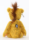 Scuggs is an endearingly sweet and gently wild beautifully coloured one of a kind, mohair artist bear by Barbara-Ann Bears, he stands 13 inches/33 cm tall and is 10.5 inches/26 cm sitting. He is made from gold mohair which has a dark brown backcloth, with a mohawk, hand dyed paw pads, and hand painted eyes with eyelids