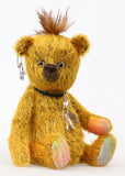 Scuggs is an endearingly sweet and gently wild beautifully coloured one of a kind, mohair artist bear by Barbara-Ann Bears, he stands 13 inches/33 cm tall and is 10.5 inches/26 cm sitting. He is made from gold mohair which has a dark brown backcloth, with a mohawk, hand dyed paw pads, and hand painted eyes with eyelids