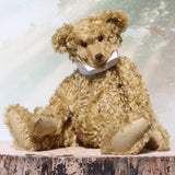 Walter is a large traditional one of a kind artist teddy bear in antique gold mohair by Barbara Ann Bears with an Edwardian collar he stands 21.5 inches/54cm tall. Walter has beige wool-felt paw pads, amber glass eyes, a neat hand embroidered nose and a sweet smile. Walter comes with an Edwardian style shirt collar and stud.