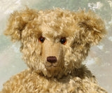 Walter is a large traditional one of a kind artist teddy bear in antique gold mohair by Barbara Ann Bears with an Edwardian collar he stands 21.5 inches/54cm tall. Walter has beige wool-felt paw pads, amber glass eyes, a neat hand embroidered nose and a sweet smile. Walter comes with an Edwardian style shirt collar and stud, but decided to take it off for this photo.