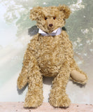 Walter is a large traditional one of a kind artist teddy bear in antique gold mohair by Barbara Ann Bears with an Edwardian collar he stands 21.5 inches/54cm tall. Walter has beige wool-felt paw pads, amber glass eyes, a neat hand embroidered nose and a sweet smile. Walter comes with an Edwardian style shirt collar and stud.