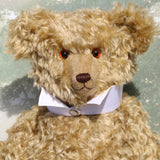Walter is a large traditional one of a kind artist teddy bear in antique gold mohair by Barbara Ann Bears with an Edwardian collar he stands 21.5 inches/54cm tall. Walter has beige wool-felt paw pads, amber glass eyes, a neat hand embroidered nose and a sweet smile. Walter comes with an Edwardian style shirt collar and stud.