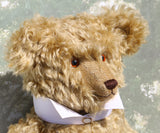 Walter is a large traditional one of a kind artist teddy bear in antique gold mohair by Barbara Ann Bears with an Edwardian collar he stands 21.5 inches/54cm tall. Walter has beige wool-felt paw pads, amber glass eyes, a neat hand embroidered nose and a sweet smile. Walter comes with an Edwardian style shirt collar and stud.