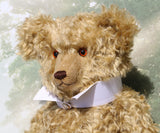 Walter is a large traditional one of a kind artist teddy bear in antique gold mohair by Barbara Ann Bears with an Edwardian collar he stands 21.5 inches/54cm tall. Walter has beige wool-felt paw pads, amber glass eyes, a neat hand embroidered nose and a sweet smile. Walter comes with an Edwardian style shirt collar and stud.