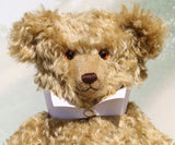 Walter is a large traditional one of a kind artist teddy bear in antique gold mohair by Barbara Ann Bears with an Edwardian collar he stands 21.5 inches/54cm tall. Walter has beige wool-felt paw pads, amber glass eyes, a neat hand embroidered nose and a sweet smile. Walter comes with an Edwardian style shirt collar and stud.